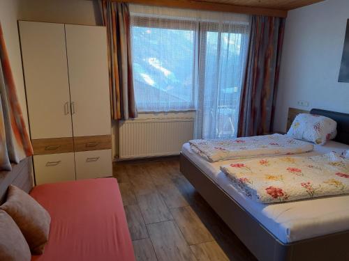 Postel nebo postele na pokoji v ubytování Appartement Haus Gatterer