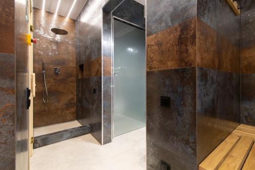 a bathroom with a shower with a glass door at Kalinowa z sauną, Sun & Snow in Szczyrk