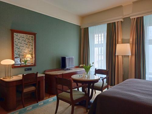 Postel nebo postele na pokoji v ubytování Grand Hotel