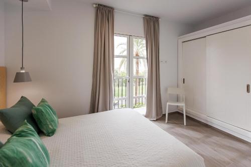 a bedroom with a large bed and a window at Chalet adosado en Pasito PTOM23 in Pasito Blanco