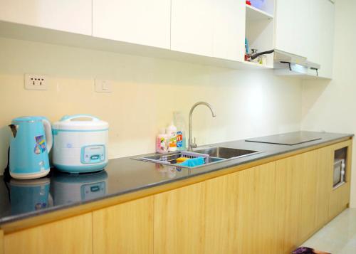 a kitchen with a sink and a counter top at Penhouse 4 ngủ View biển rộng 160m2 in Ha Long