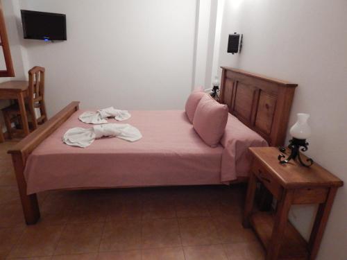 Ένα ή περισσότερα κρεβάτια σε δωμάτιο στο Hotel Colonial