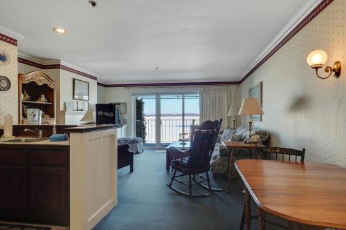 a kitchen and living room with a table and chairs at 212 Water Street Inn in Boyne City