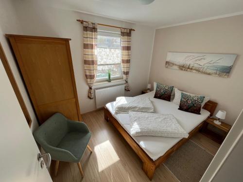 En eller flere senge i et værelse på Ferienwohnung Sonnenschein