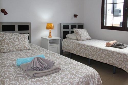 Postel nebo postele na pokoji v ubytování Villa Mariesa