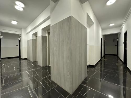 a hallway with a large wooden wall in a building at Luxury Studios in Iaşi