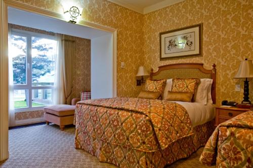 En eller flere senger på et rom på Terelj Hotel & Spa