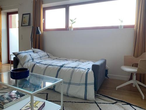 Ένα ή περισσότερα κρεβάτια σε δωμάτιο στο Le Balcon Rouge