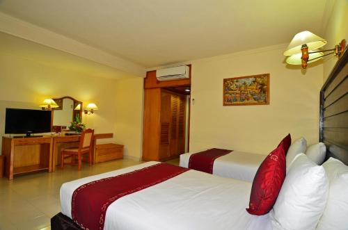 
インナ シンドゥ ビーチ ホテル＆リゾートにあるベッド
