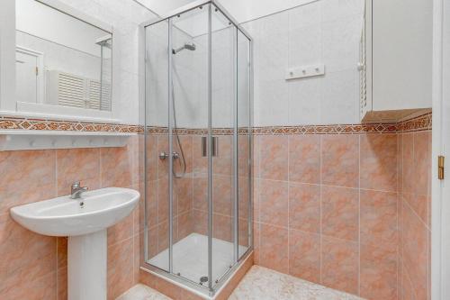 a bathroom with a shower and a sink at Bonita Casa Nina in Playa de San Juan