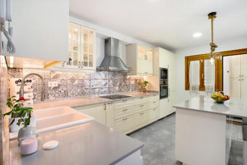 Кухня или мини-кухня в Luz Home
