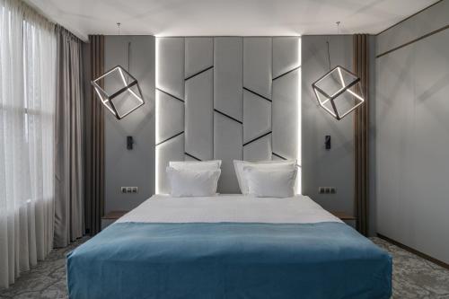 Un ou plusieurs lits dans un hébergement de l'établissement Rosslyn Dimyat Hotel Varna