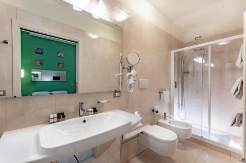 a bathroom with a sink and a toilet and a shower at Residenza Manin Apartments in Venice