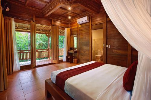 Säng eller sängar i ett rum på Ubud Heaven Sayan