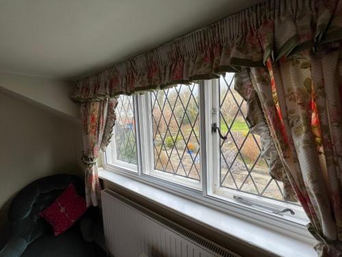 a window with a view of a yard at Pentre Cerrig Country House in Llanferres