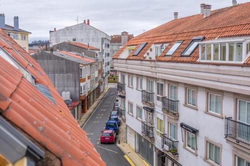 an overhead view of a city street with buildings at Casa Naseiro in Melide