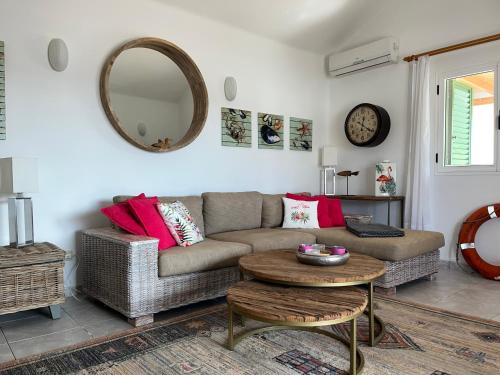a living room with a couch and a table at Casa el Nido in Charco del Palo