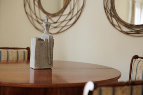 a small statue sitting on top of a table at Mon Repos Maison in Corfu Town
