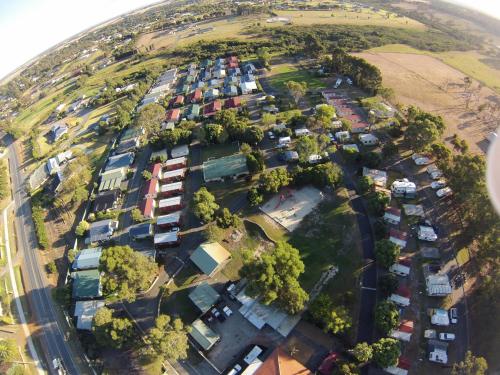 an aerial view of a city with houses and trees at Albany Holiday Park in Albany