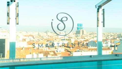 a view of a city from a swimming pool at SmartRental Collection Gran Vía Capital in Madrid