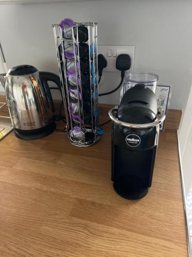 a blender sitting on top of a counter at Kabin in the woods with Hot Tub in Llandybie