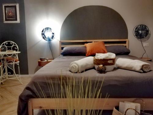 a bedroom with a bed with two pillows on it at B&B DOMUS 65 in Aragona