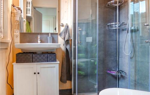 a bathroom with a sink and a shower at Haus Panoramablick in Lennestadt