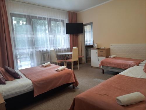 Postel nebo postele na pokoji v ubytování Willa Paweł z balią i jacuzzi