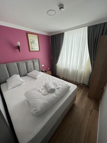 Postel nebo postele na pokoji v ubytování MİRHAN HOTEL
