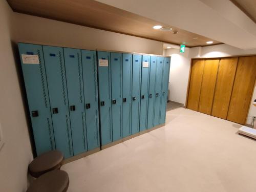 a row of lockers in a locker room at Hotel Edoya in Tokyo