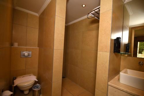 a bathroom with a toilet and a sink at Gorgeous Flat near Hadrian's Gate in Antalya