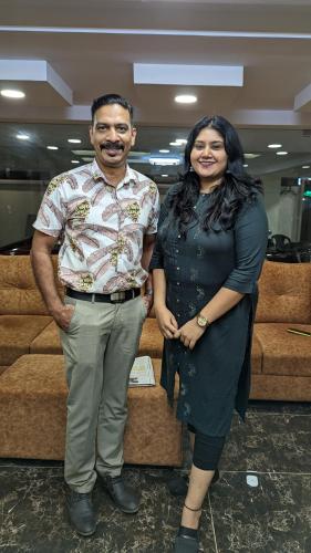 a man and a woman posing for a picture at Dreams Paradise Airport Residency in Nedumbassery