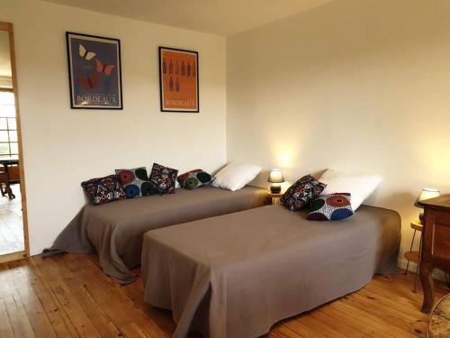 Un ou plusieurs lits dans un hébergement de l'établissement La Part des Anges votre studio à la campagne