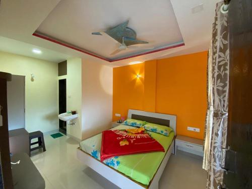 a bedroom with a bed with a star on the ceiling at Mayuri cottage in Mahabaleshwar