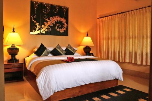 Ένα ή περισσότερα κρεβάτια σε δωμάτιο στο Shining Angkor Apartment Hotel