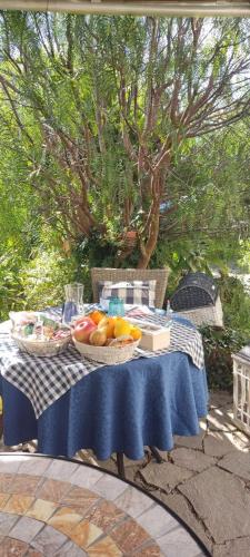 a table with two baskets of fruit on it at La Pirata Capitana in Costa degli Angeli