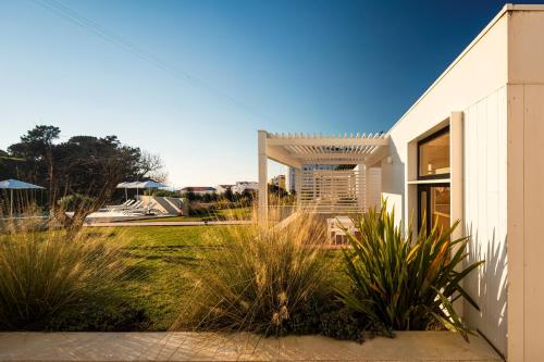 a white house with plants in front of it at Ericeira Prime Villas in Ericeira