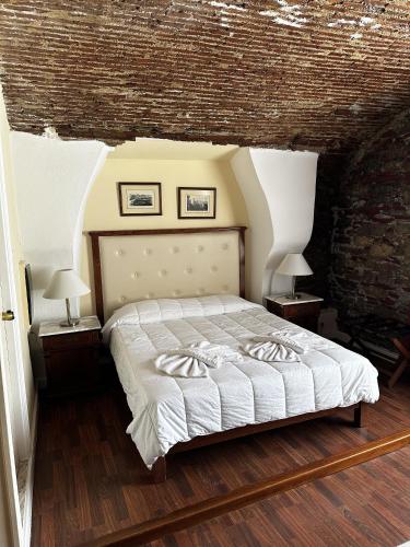 Un ou plusieurs lits dans un hébergement de l'établissement Hotel Aktaion Syros