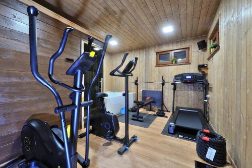 a gym with several exercise bikes and a treadmill at Lakeside Hotel Plitvice in Plitvička Jezera