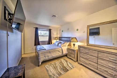 a bedroom with a bed and a large mirror at Norfolk Vacation Rental Patio, 3 Mi to Beaches! in Norfolk