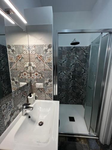 a bathroom with a sink and a shower at Casa Aurora Isola di Vulcano in Vulcano