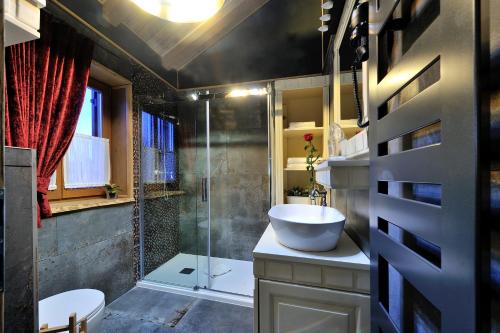 a bathroom with a sink and a shower at Lakeside Hotel Plitvice in Plitvička Jezera