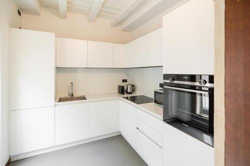 Η κουζίνα ή μικρή κουζίνα στο Domus Verona - Residenza Marconi