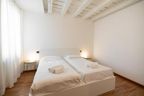 Ένα ή περισσότερα κρεβάτια σε δωμάτιο στο Domus Verona - Residenza Marconi