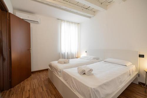 Ένα ή περισσότερα κρεβάτια σε δωμάτιο στο Domus Verona - Residenza Marconi