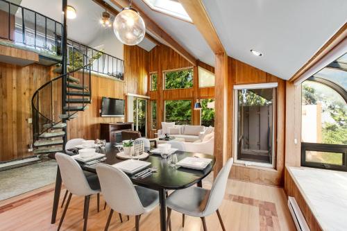 a dining room with a table and chairs at The Treehouse in Bellingham