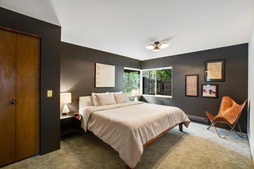 a bedroom with a bed and a window at The Treehouse in Bellingham