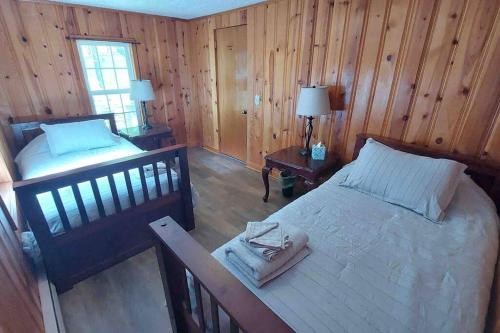 an aerial view of a bedroom with a bed at Riverside Cabin with Private Fishing Access! in Pulaski