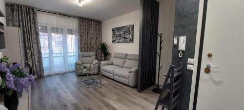 a living room with a couch and a table at Nadia&V in Marghera