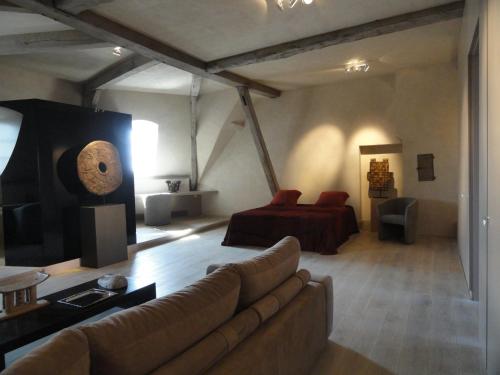 a living room with a couch and a bed at Château de Vierset in Vierset-Barse